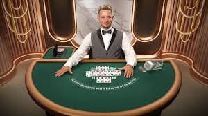 Live casino dealer table with roulette wheel and professional studio setup